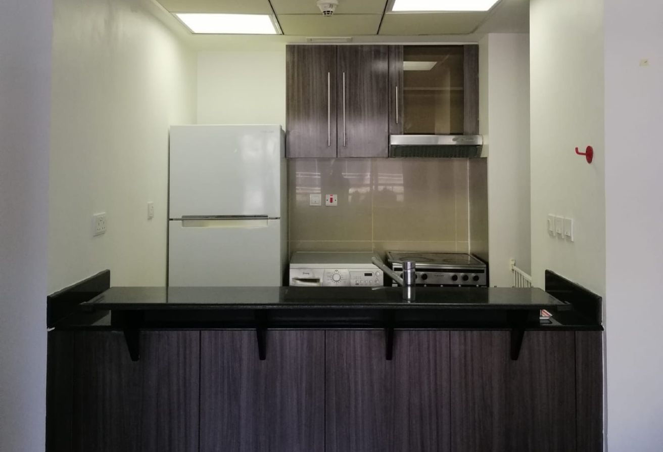 Studio apartment for sale in Tower 21 Al Reef Downtown Abu Dhabi with balcony, rented until 2025, strong ROI investment