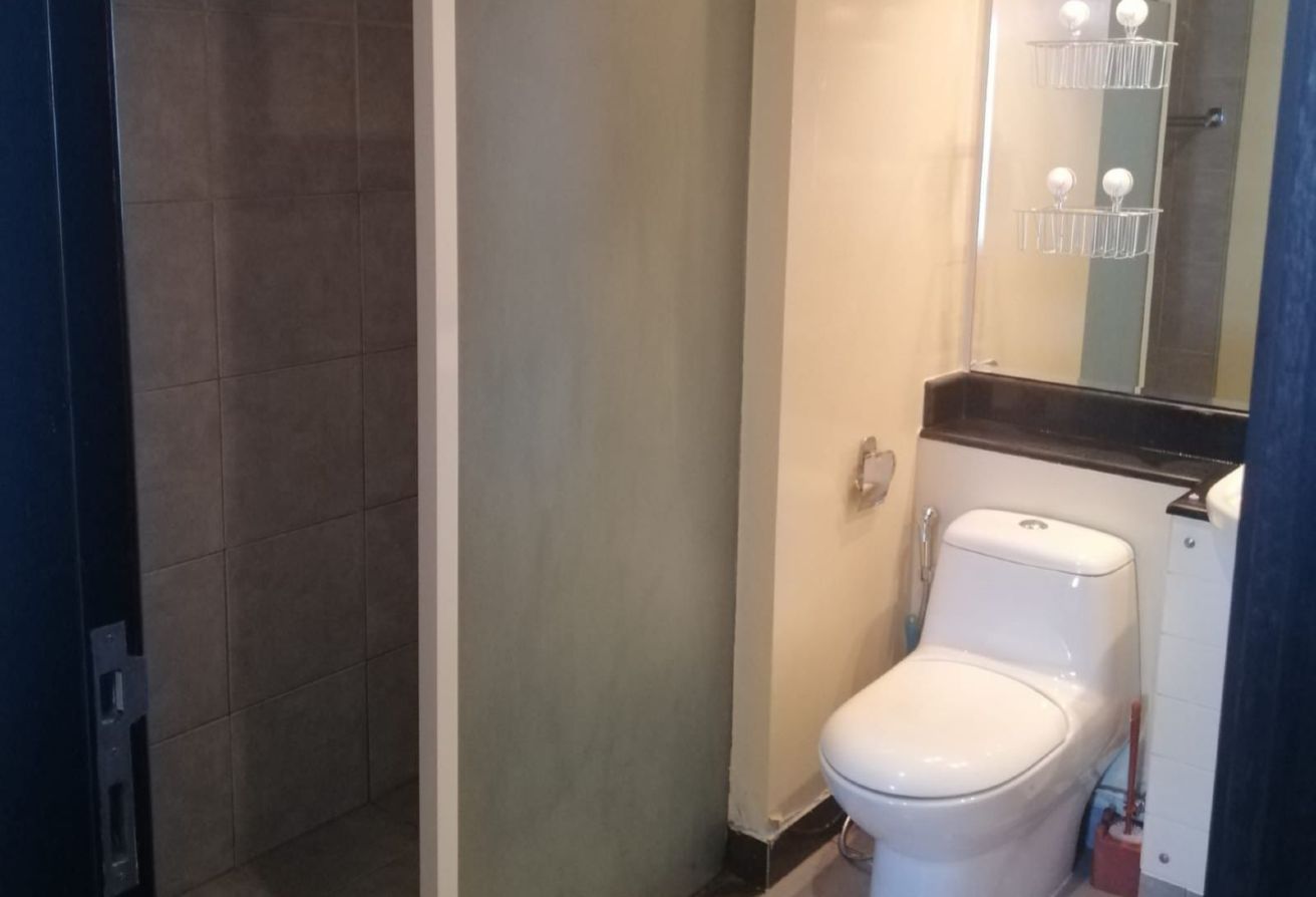 Studio apartment for sale in Tower 21 Al Reef Downtown Abu Dhabi with balcony, rented until 2025, strong ROI investment