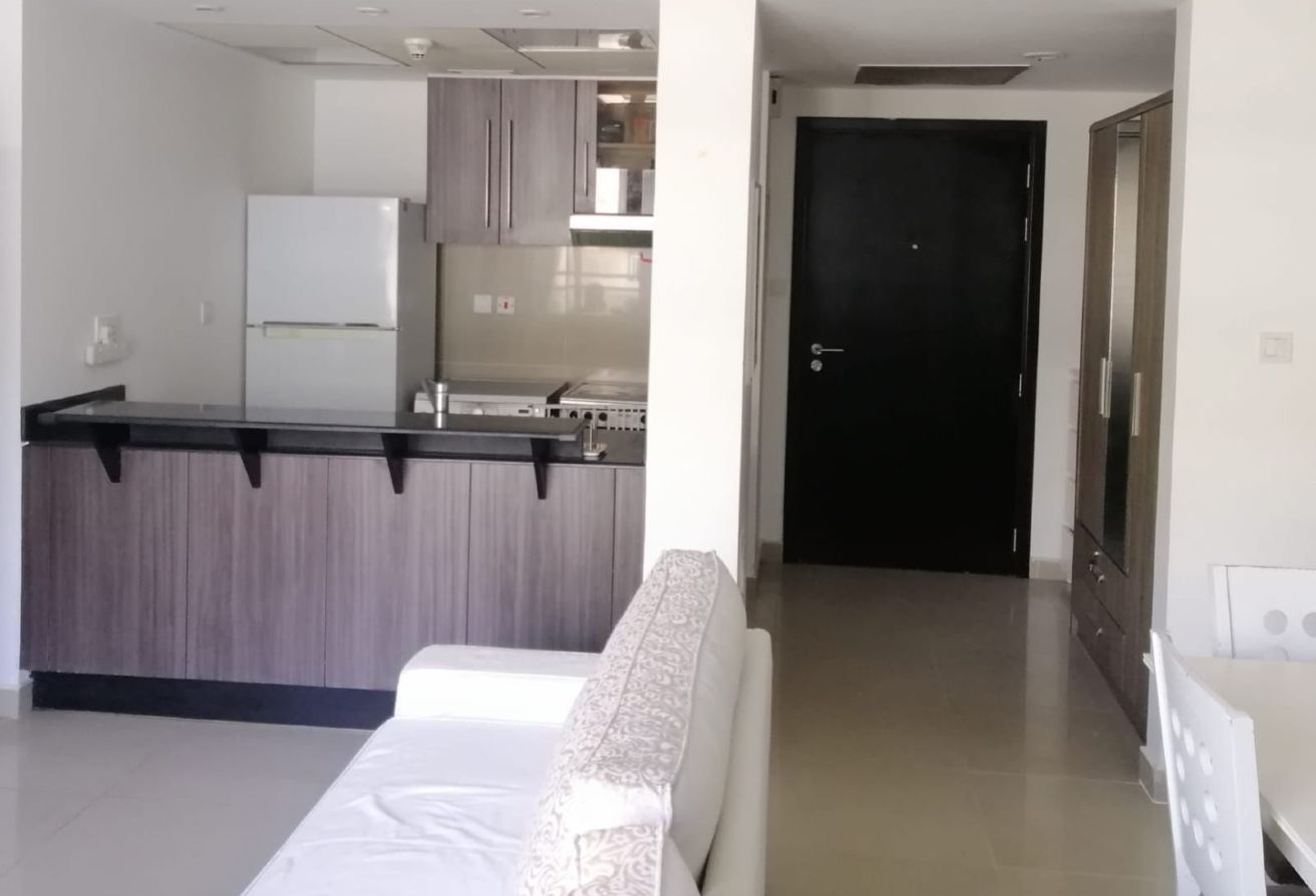 Affordable studio apartment for sale in Tower 21 Al Reef Downtown Abu Dhabi with balcony, parking, and shared poo