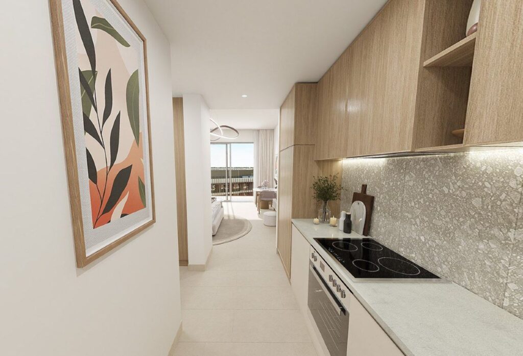 Top-floor studio apartment for sale in Gardenia Bay Yas Island Abu Dhabi with balcony street view, modern layout, and strong ROI investment.