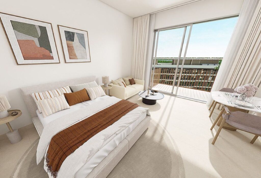 Top-floor studio apartment for sale in Gardenia Bay Yas Island Abu Dhabi with balcony street view, modern layout, and strong ROI investment.