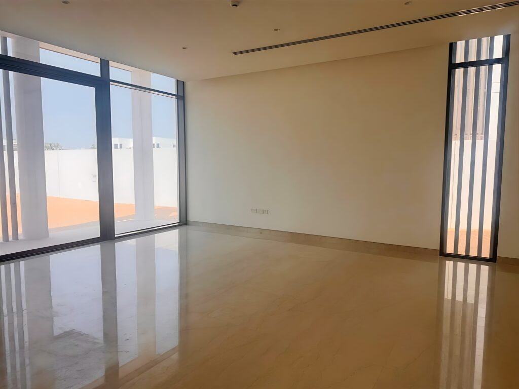 Waterfront 5-bedroom villa for sale in Seef Al Jubail Abu Dhabi with modern design, balconies, and exclusive luxury community amenities