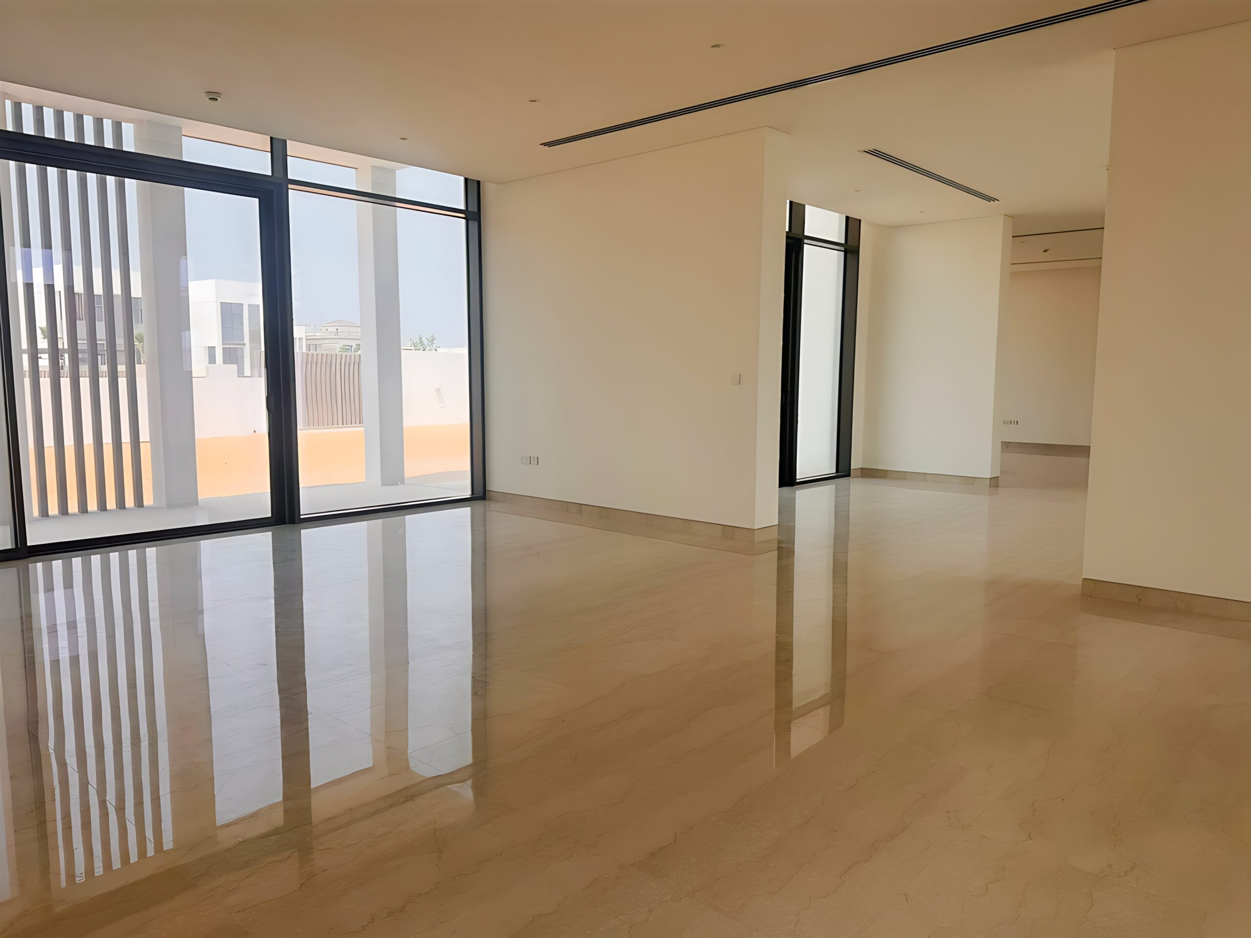 Waterfront 5-bedroom villa for sale in Seef Al Jubail Abu Dhabi with modern design, balconies, and exclusive luxury community amenities