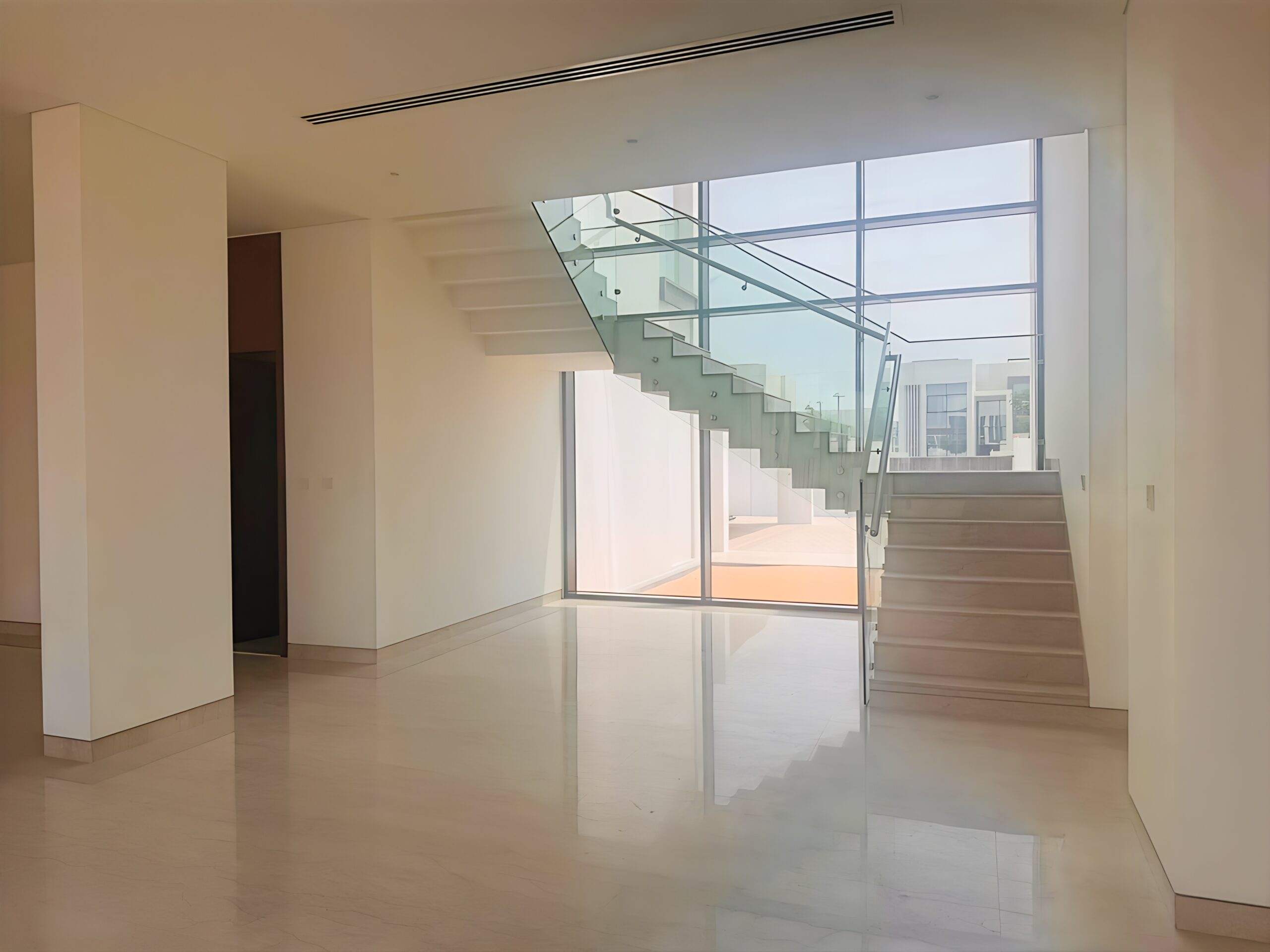 Waterfront 5-bedroom villa for sale in Seef Al Jubail Abu Dhabi with modern design, balconies, and exclusive luxury community amenities