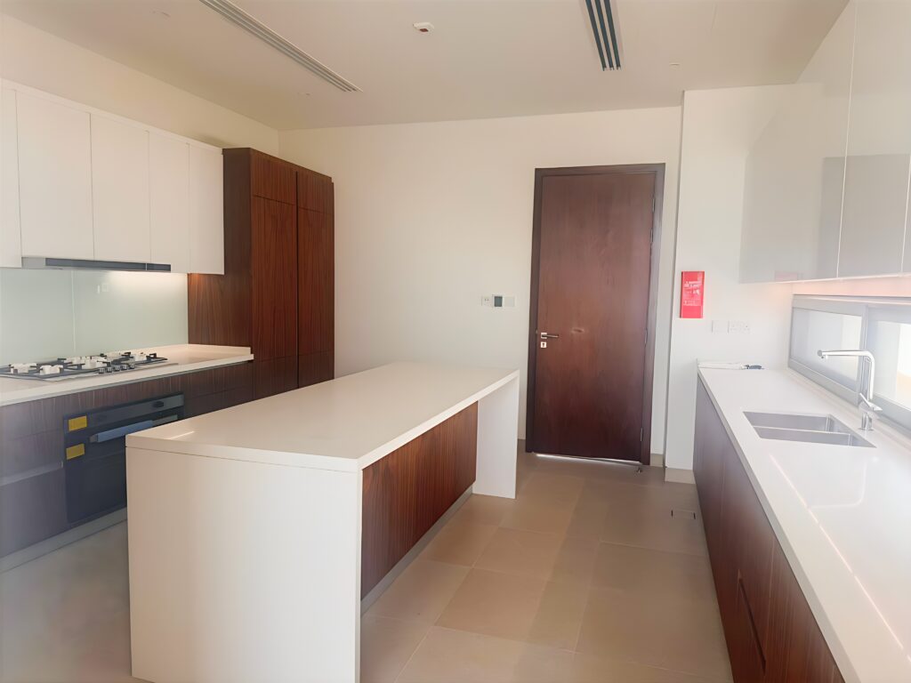 Waterfront 5-bedroom villa for sale in Seef Al Jubail Abu Dhabi with modern design, balconies, and exclusive luxury community amenities