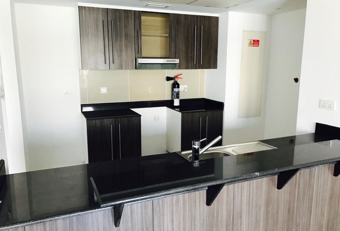 Spacious 2-bedroom apartment with balcony in Al Reef Downtown Abu Dhabi.