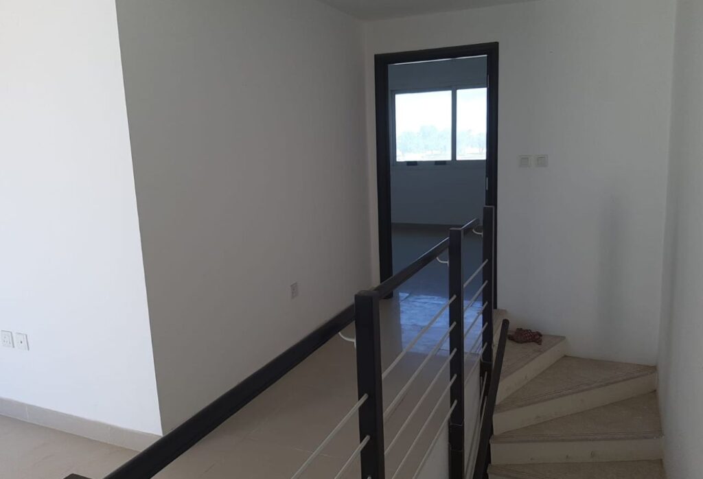 Spacious 3-bedroom villa with rooftop terrace in Al Reef Villas Abu Dhabi.