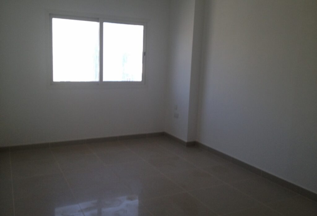 Spacious 2-bedroom apartment with balcony in Al Reef Downtown Abu Dhabi.