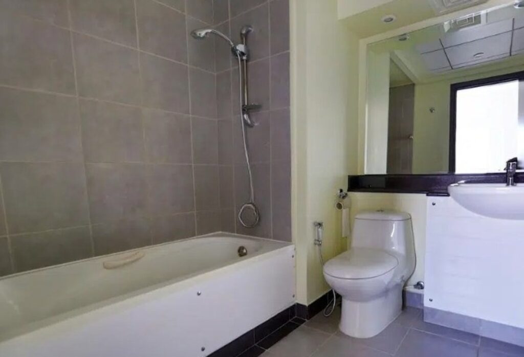 Modern 1BR apartment in Al Reef Downtown Tower 44 with balcony