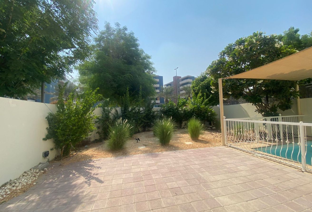 Al Reef five bedroom townhouse with rooftop terrace and garden pool.