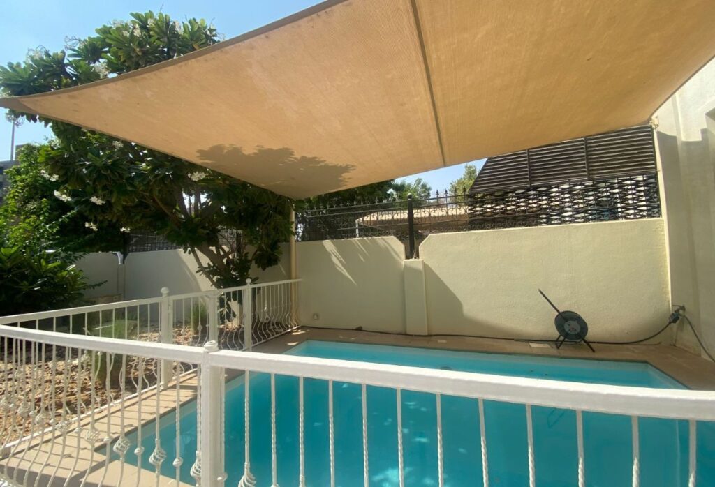 Al Reef five bedroom townhouse with rooftop terrace and garden pool.