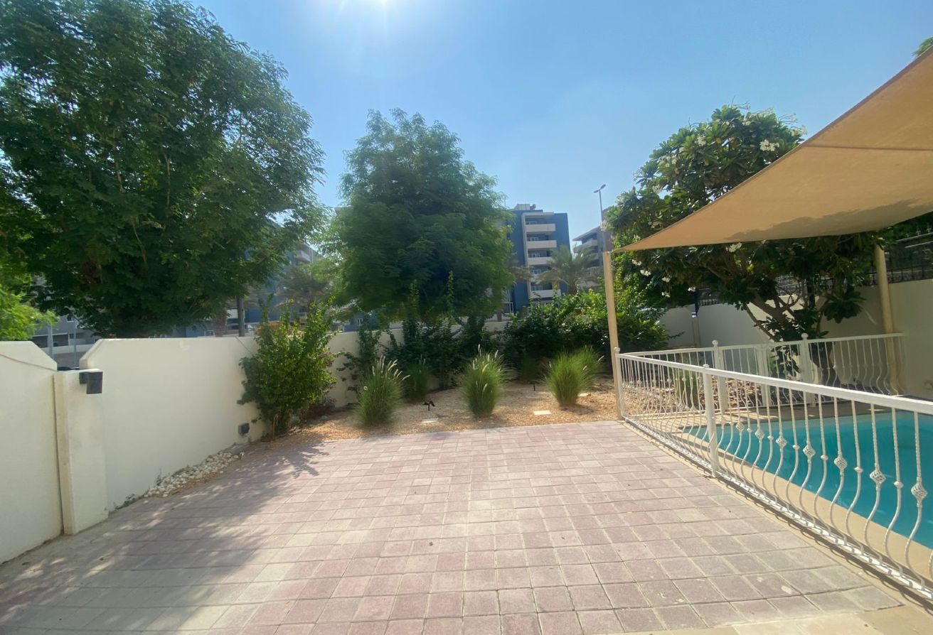 Al Reef five bedroom townhouse with rooftop terrace and garden pool.