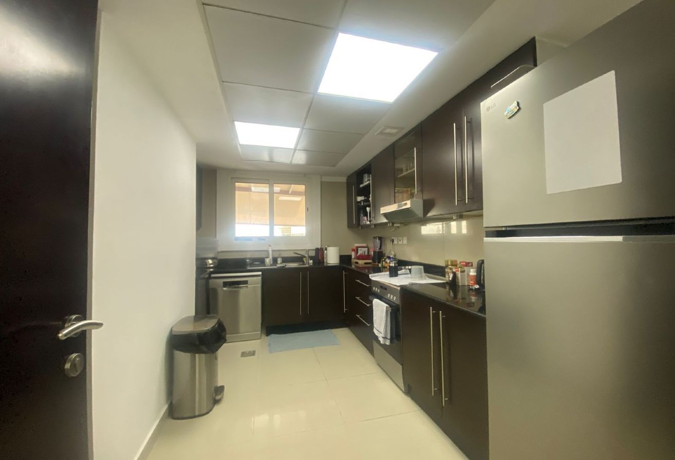 Al Reef five bedroom townhouse with rooftop terrace and garden pool.