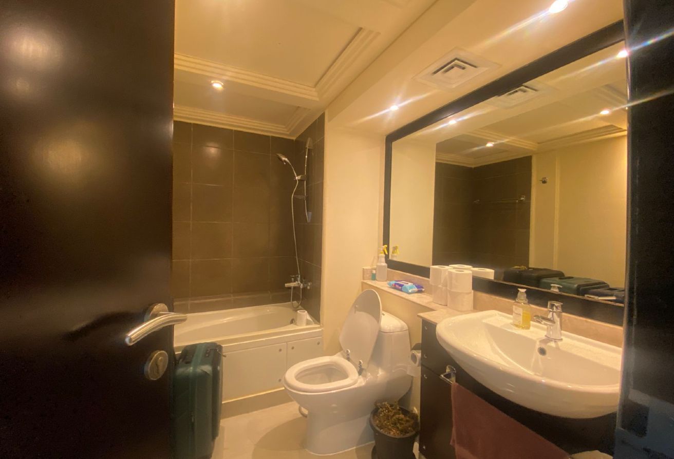 Al Reef five bedroom townhouse with rooftop terrace and garden pool.