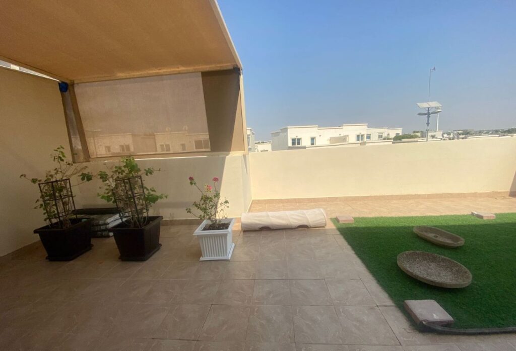 Al Reef five bedroom townhouse with rooftop terrace and garden pool.