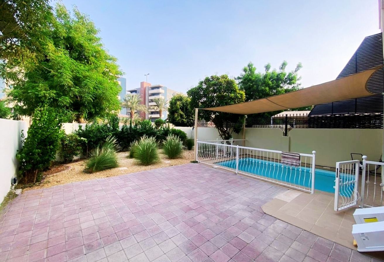 Al Reef five bedroom townhouse with rooftop terrace and garden pool.