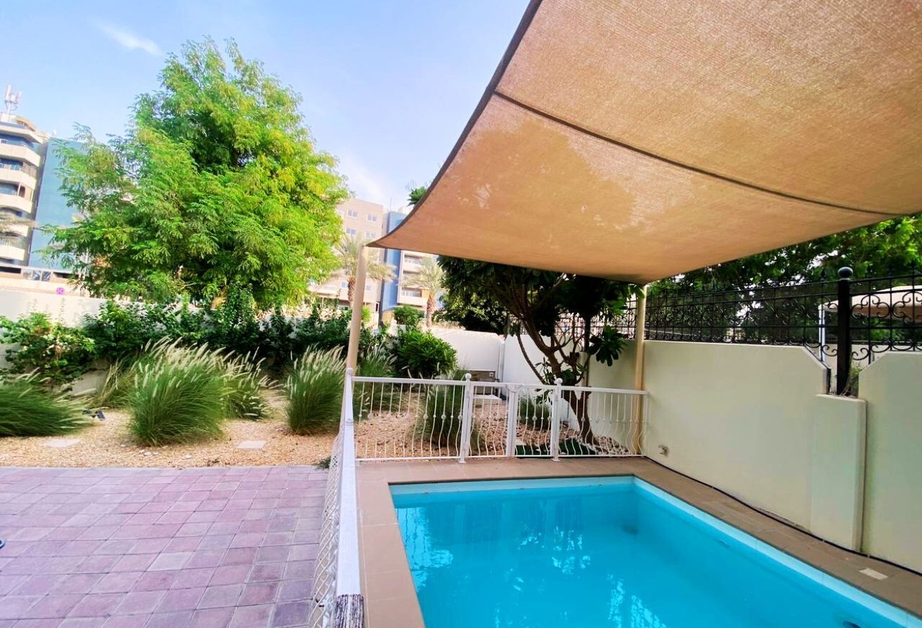 Al Reef five bedroom townhouse with rooftop terrace and garden pool.