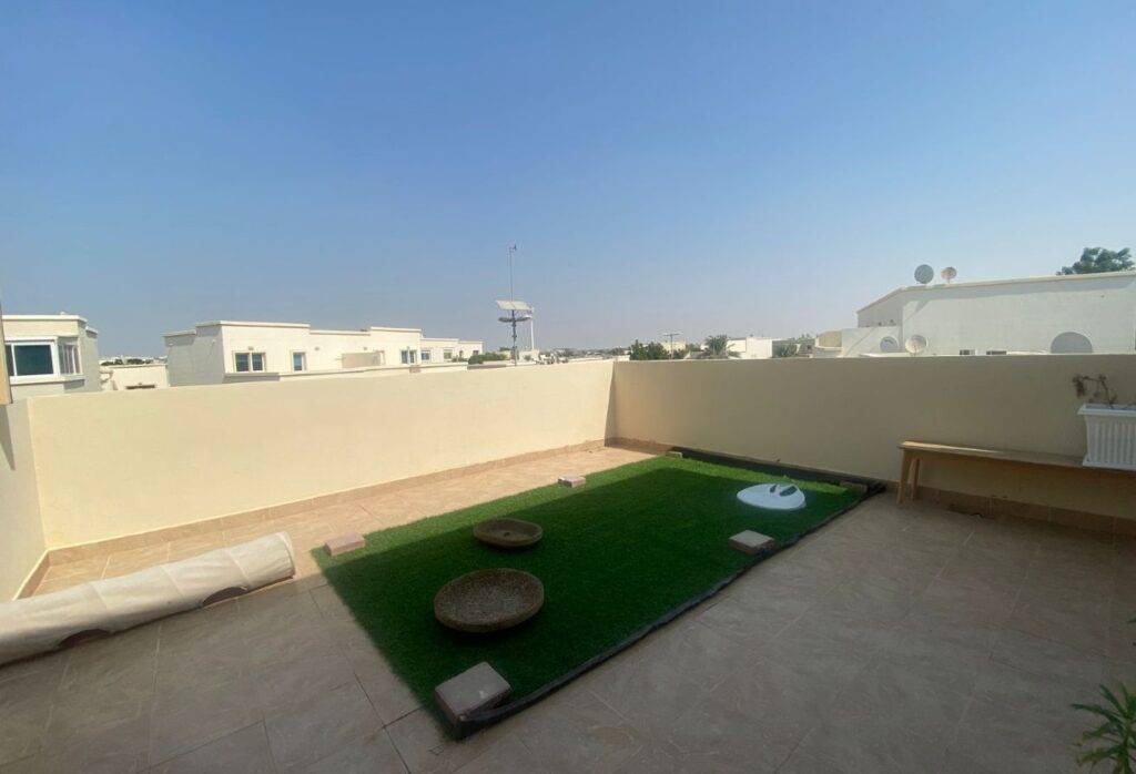 Al Reef five bedroom townhouse with rooftop terrace and garden pool.