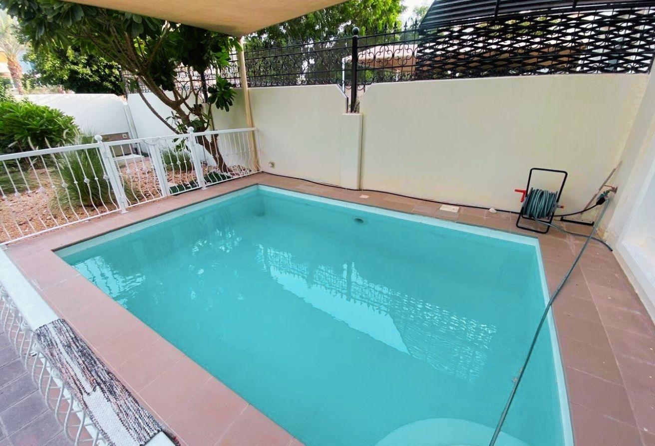 Al Reef five bedroom townhouse with rooftop terrace and garden pool.