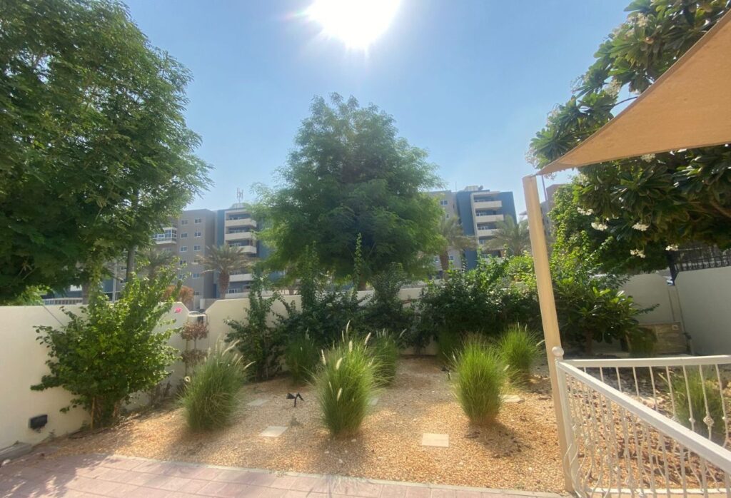 Al Reef five bedroom townhouse with rooftop terrace and garden pool.