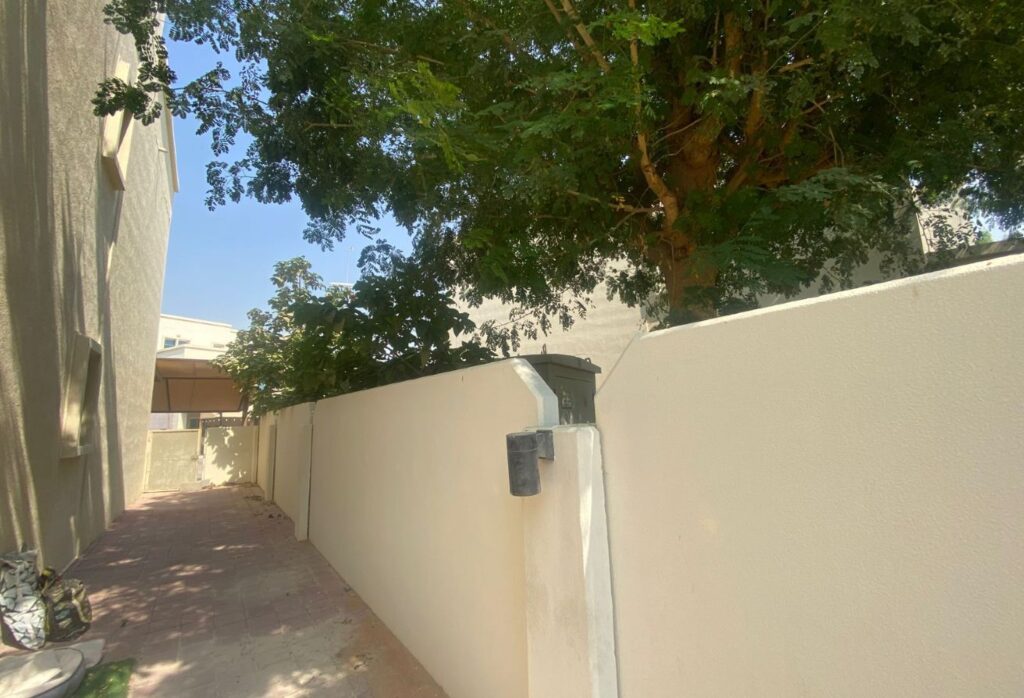 Al Reef five bedroom townhouse with rooftop terrace and garden pool.