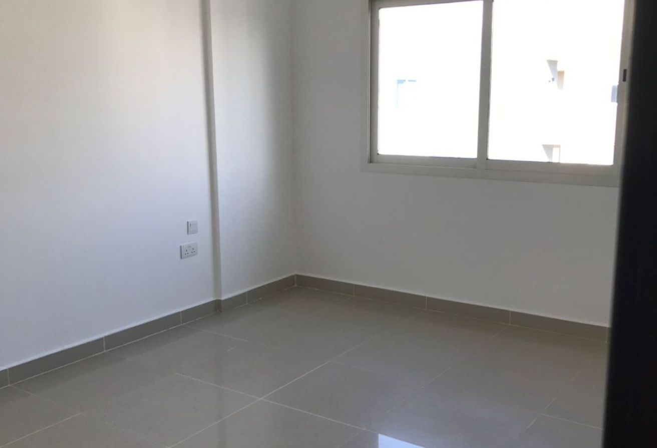 Al Reef Downtown 2 bedroom apartment balcony rent refund Abu Dhabi